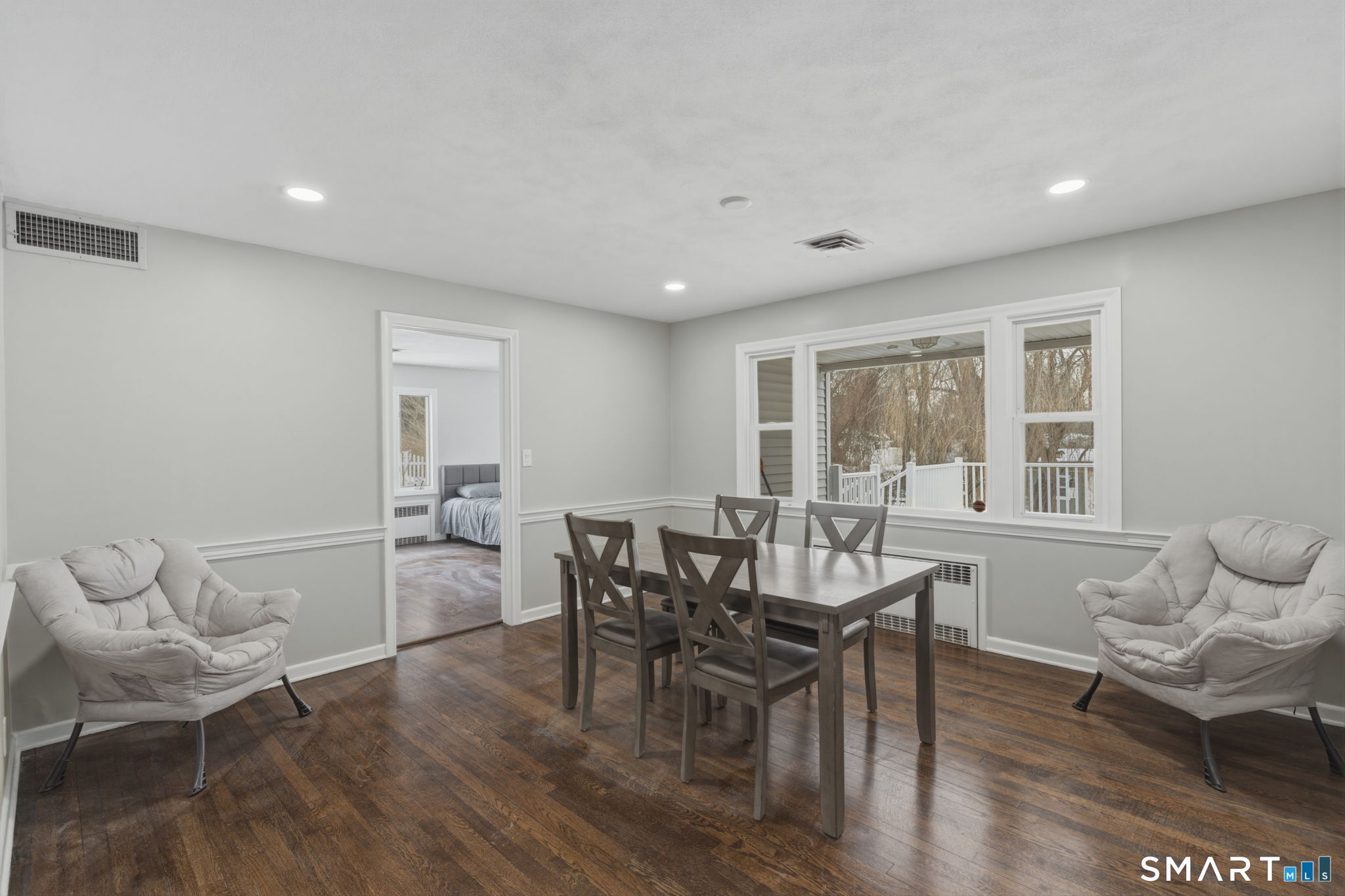 35 West Ridge Drive West Hartford, CT 06117 - Photo 14 of 38 a view of a dining room with furniture window and wooden floor