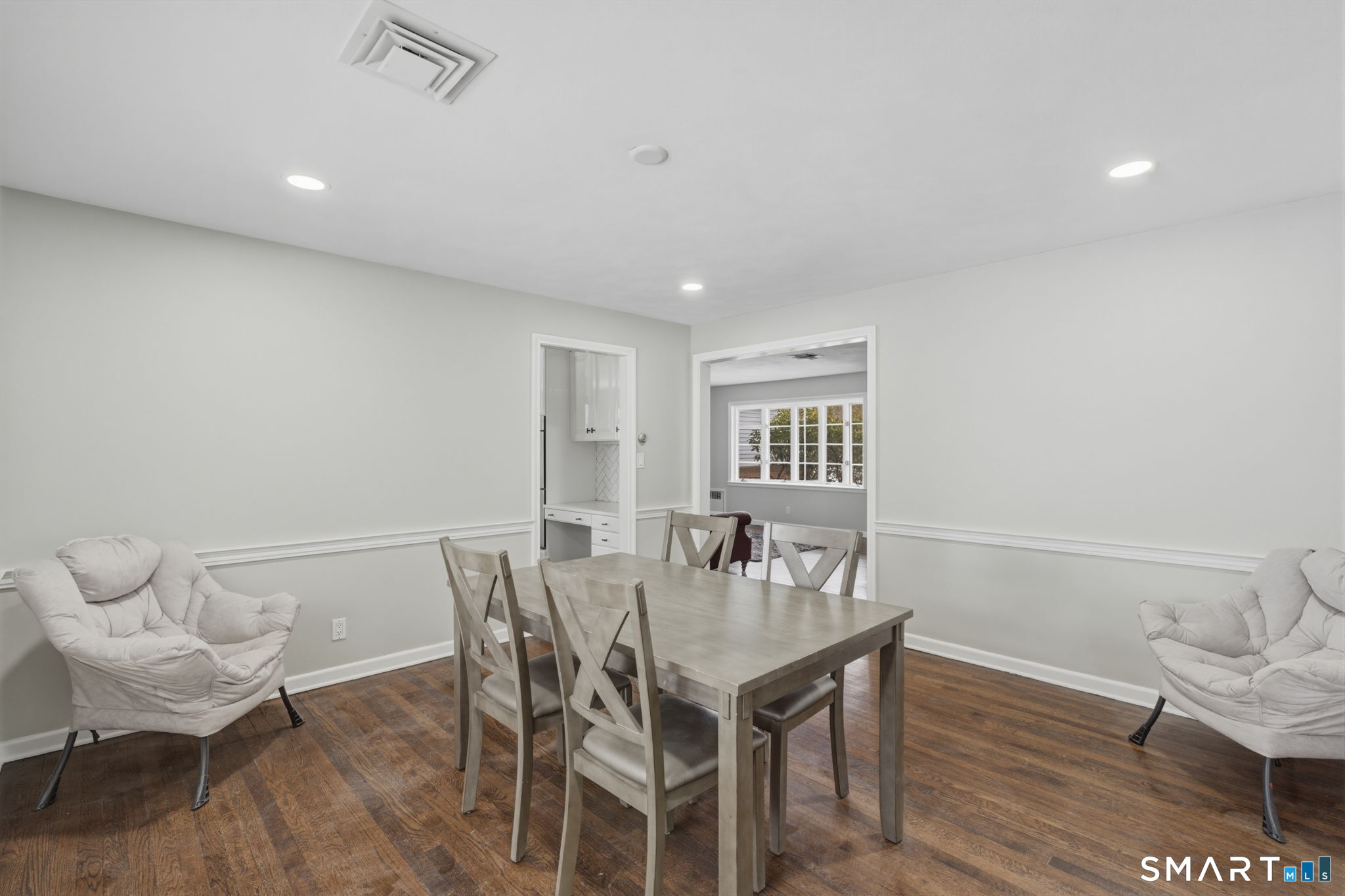 35 West Ridge Drive West Hartford, CT 06117 - Photo 15 of 38 a view of a dining room with furniture and wooden floor