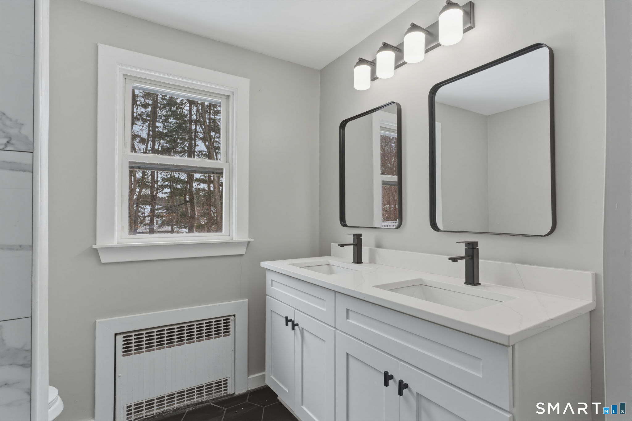 35 West Ridge Drive West Hartford, CT 06117 - Photo 22 of 38 a bathroom with double sink and a mirror