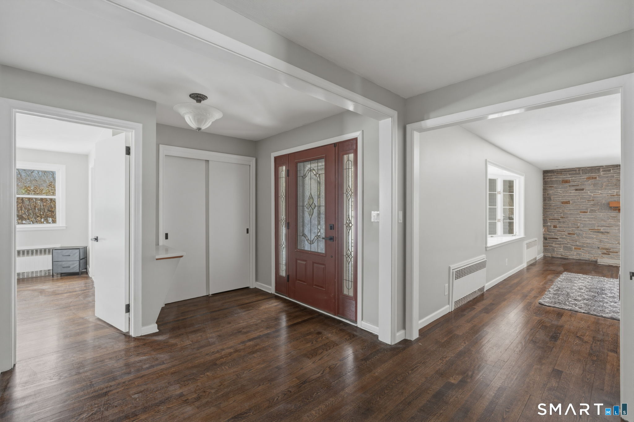 35 West Ridge Drive West Hartford, CT 06117 - Photo 5 of 38 a view of a big room with wooden floor and windows
