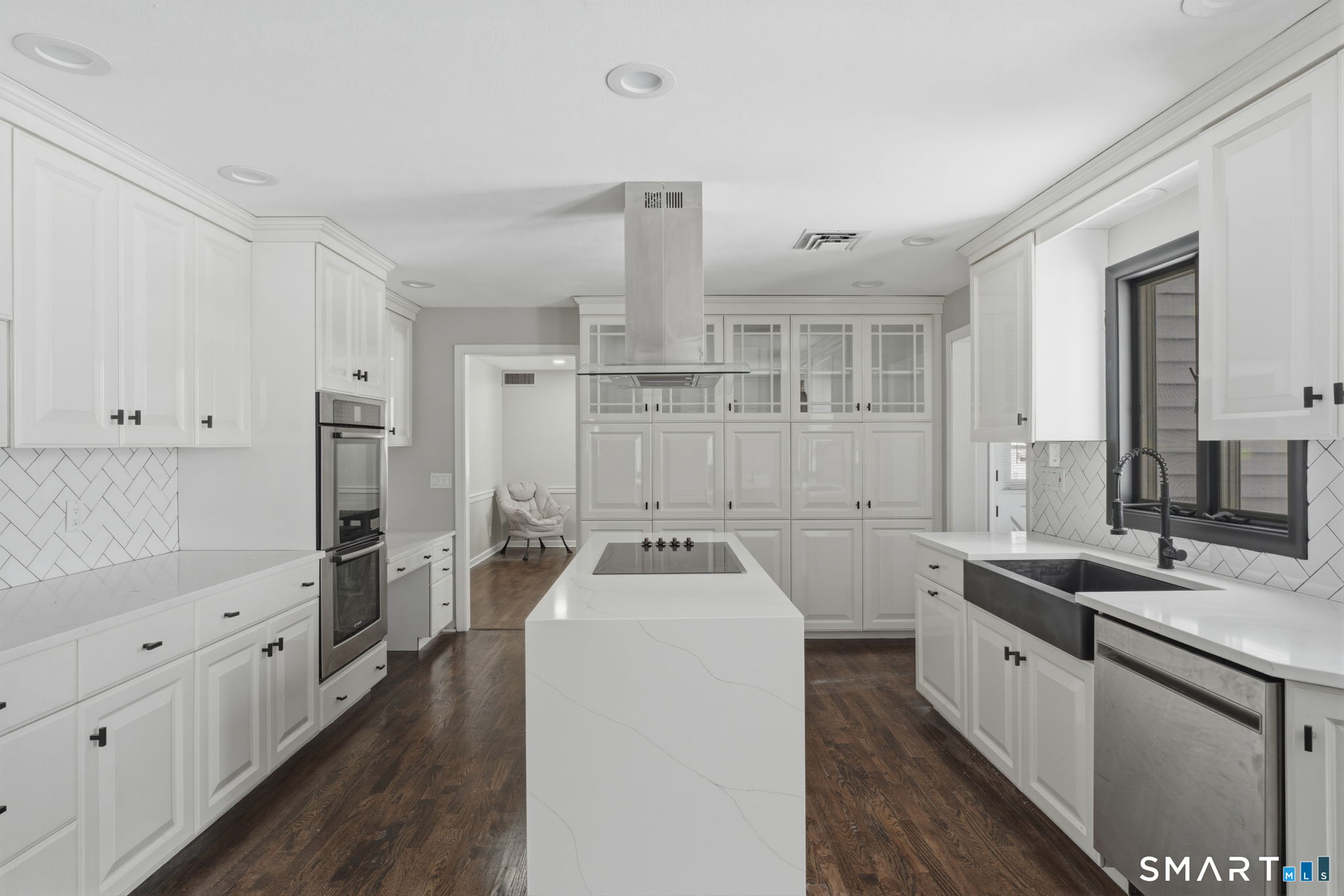 35 West Ridge Drive West Hartford, CT 06117 - Photo 10 of 38 a kitchen that has a sink a stove and a wooden floor