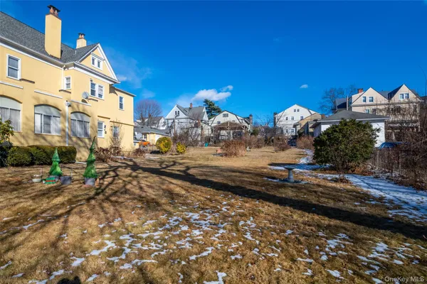 a view of a street with a building in the background