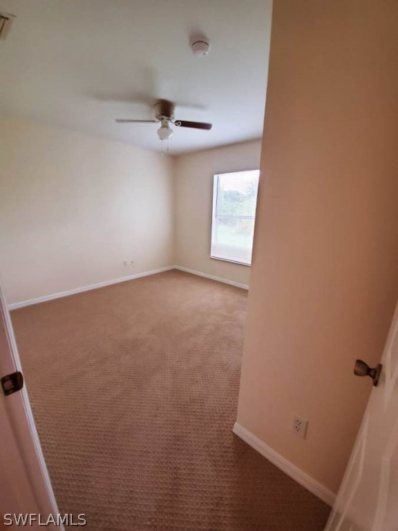 4652 27th Street Southwest Lehigh Acres, FL 33973 - Photo 12 of 21 an empty room with a window
