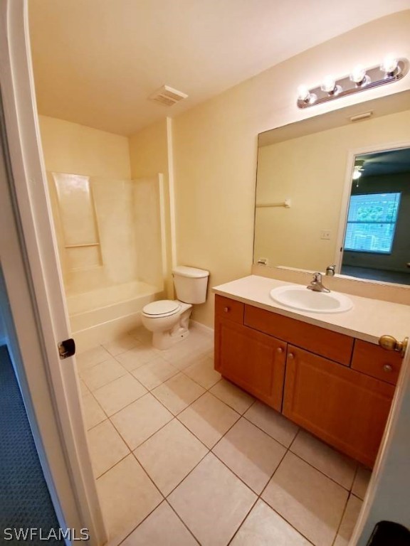 4652 27th Street Southwest Lehigh Acres, FL 33973 - Photo 13 of 21 a bathroom with a double vanity sink mirror and toilet