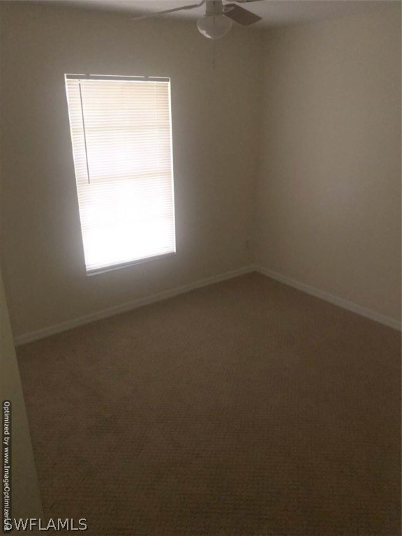 4652 27th Street Southwest Lehigh Acres, FL 33973 - Photo 14 of 21 an empty room with a window