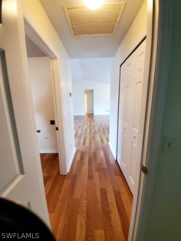 4652 27th Street Southwest Lehigh Acres, FL 33973 - Photo 17 of 21 a view of a hallway with wooden floor and staircase