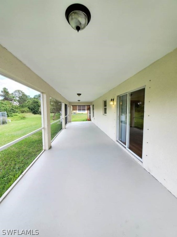 4652 27th Street Southwest Lehigh Acres, FL 33973 - Photo 18 of 21 a view of a porch with a yard