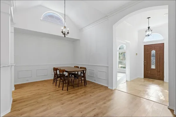 a view of a room with furniture and wooden floor