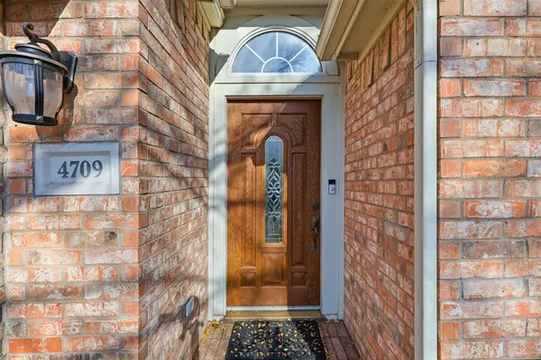 a view of a brick house with a door