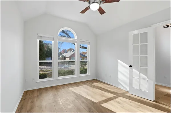 a view of an empty room with a window
