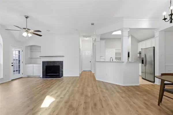 a view of kitchen with furniture and a fireplace