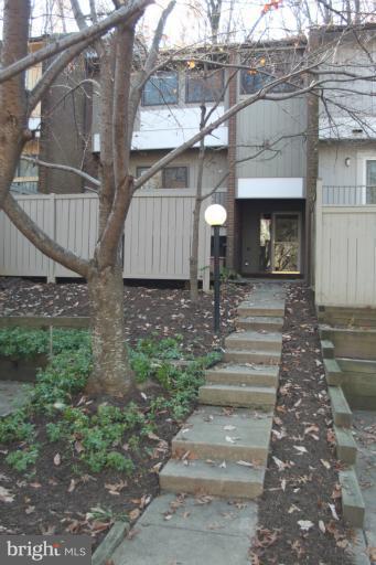 12005 Insha Court Reston, VA 20191 - Photo 1 of 22 a front view of a house with a yard