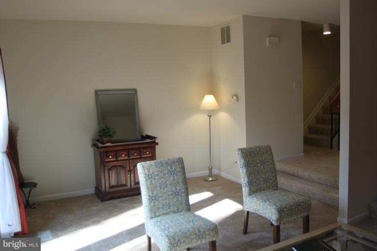 12005 Insha Court Reston, VA 20191 - Photo 5 of 22 a living room with furniture and a lamp