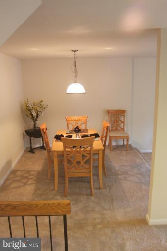 12005 Insha Court Reston, VA 20191 - Photo 7 of 22 a view of a dining room with furniture