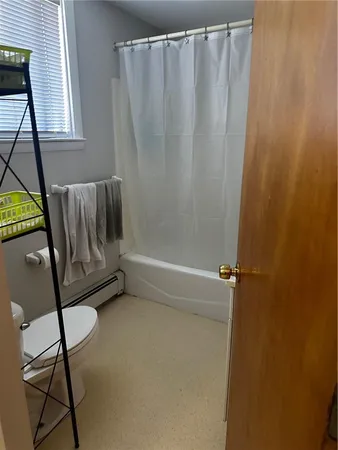 a view of a room with staircase and a window