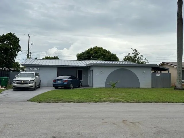 a view of a car parked in front of a house