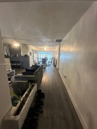 a lobby with furniture and rug