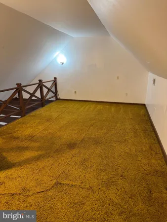 a bathroom with a toilet a sink and a mirror