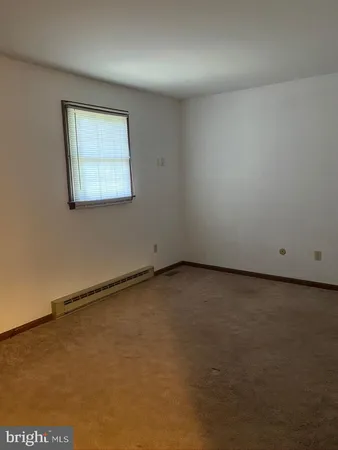 an empty room with a workbench