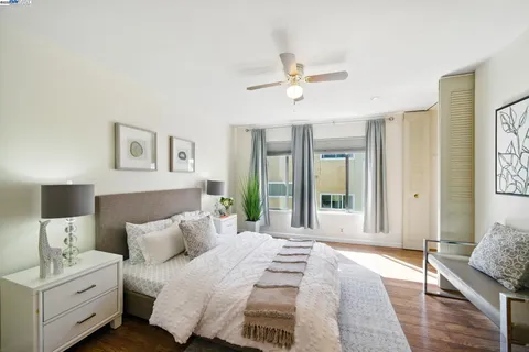 a bed room with a bed and a chandelier