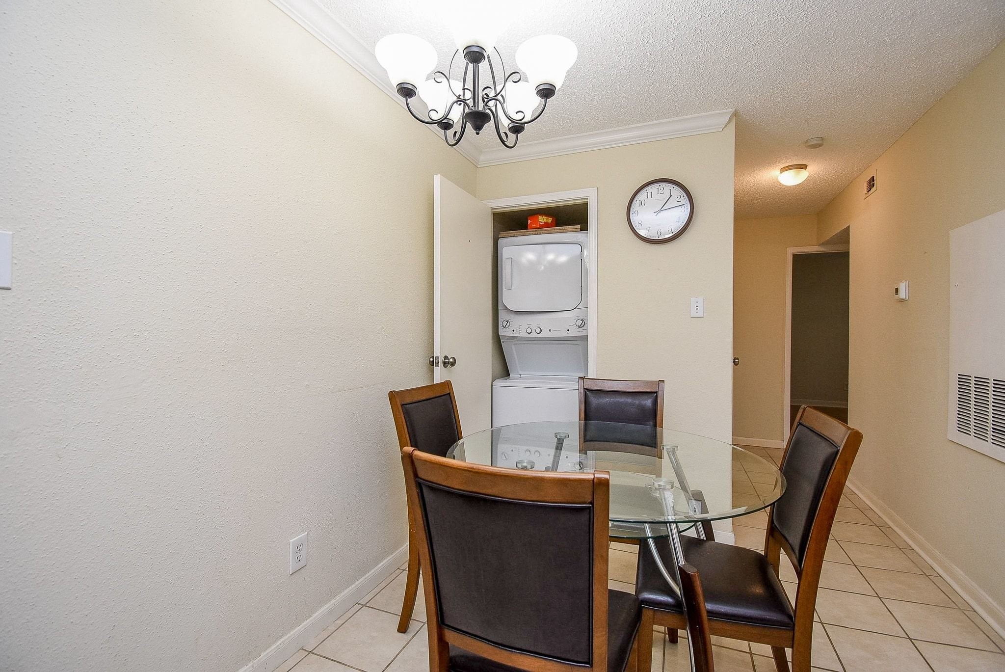 12660 Ashford Point Drive, Unit 507 Houston, TX 77082 - Photo 6 of 28 a view of a dining room with furniture and a window