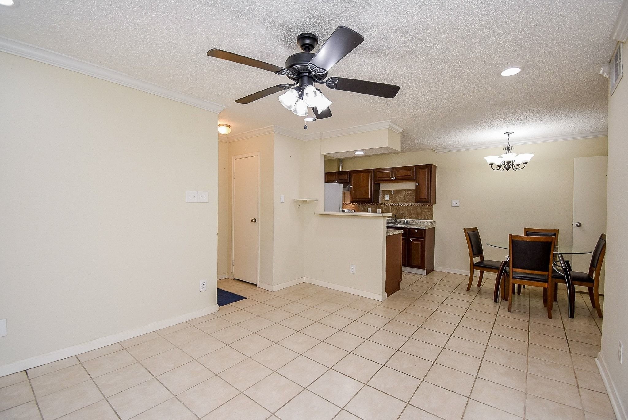 12660 Ashford Point Drive, Unit 507 Houston, TX 77082 - Photo 9 of 28 a open kitchen with cabinets and stainless steel appliances