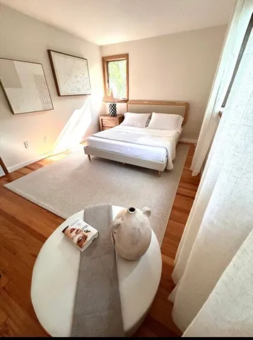 a living room with furniture and a mirror