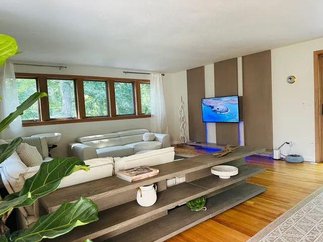 a living room with furniture and a table