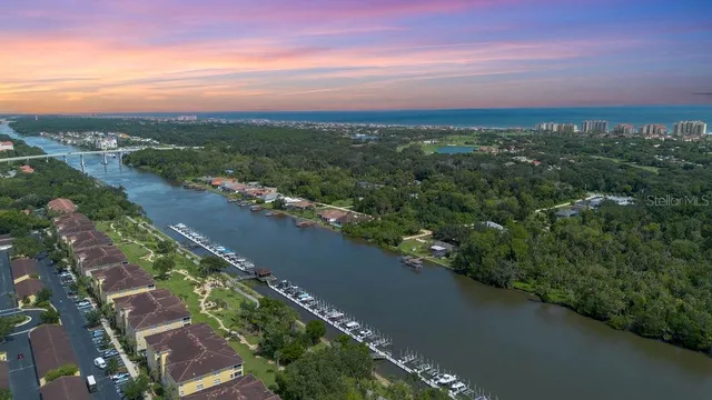 a view of a dining room with furniture wooden floor and chandelier