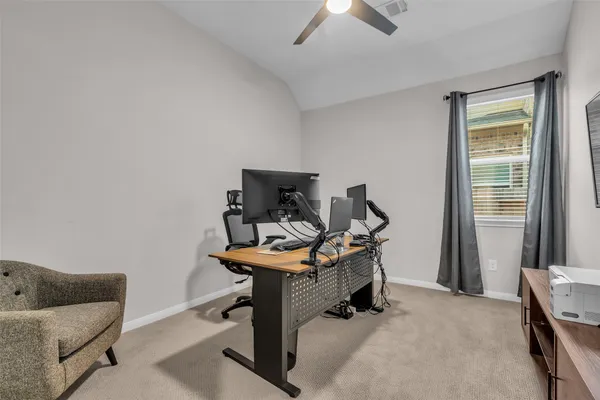 a bedroom with a bed and a night stand