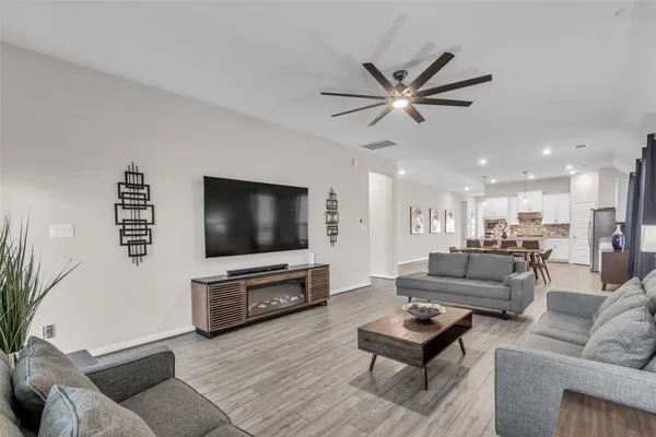 a view of a porch with furniture and garden