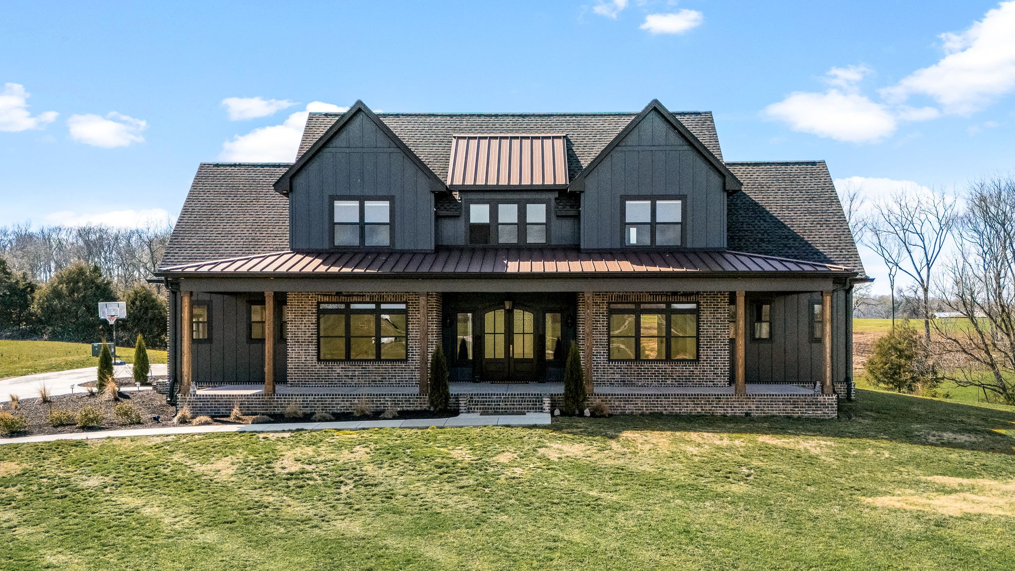 a front view of a house with a yard