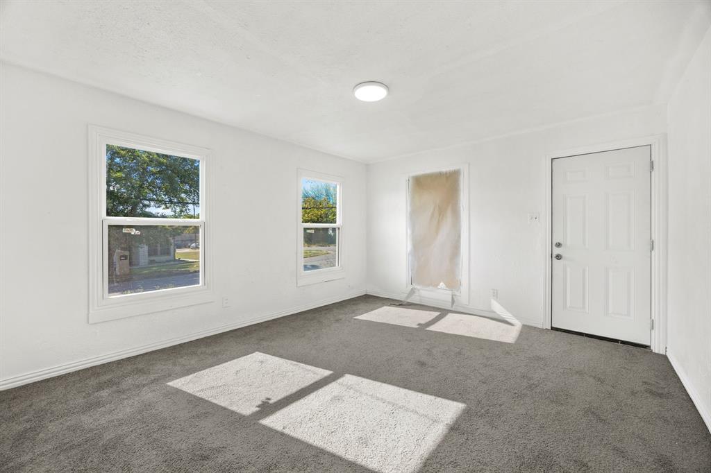 1802 Fordham Road Dallas, TX 75216 - Photo 3 of 25 an empty room with windows