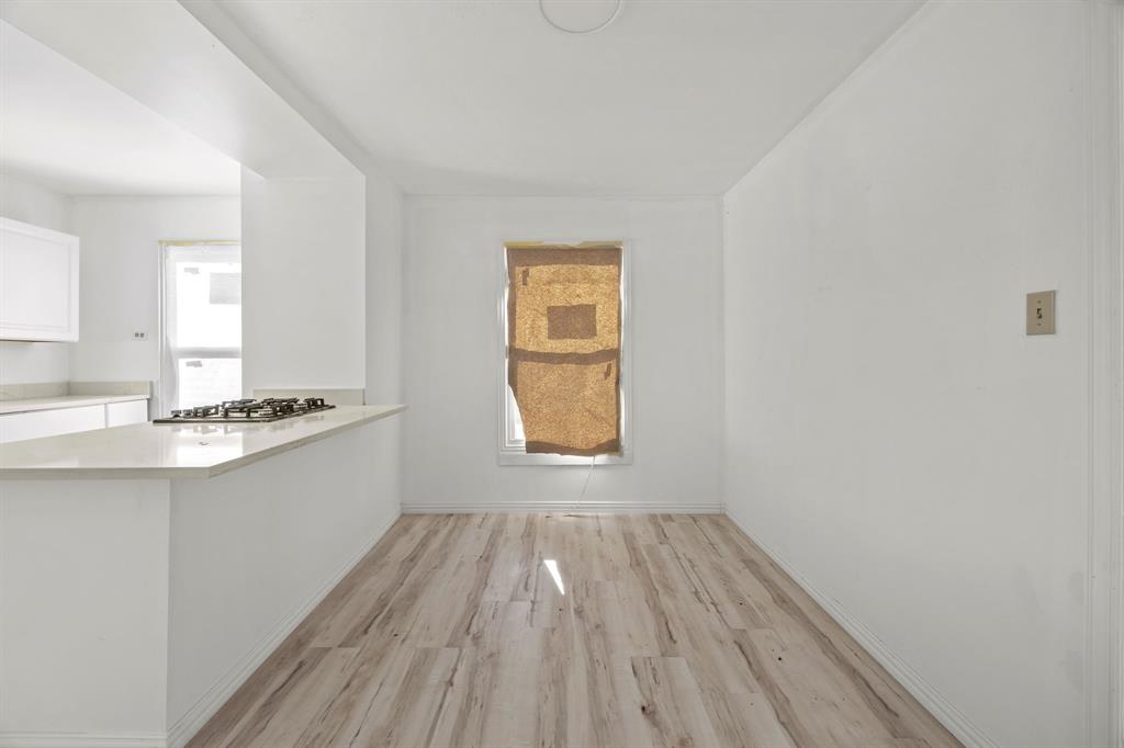 1802 Fordham Road Dallas, TX 75216 - Photo 10 of 25 a bathroom with a sink window and a mirror