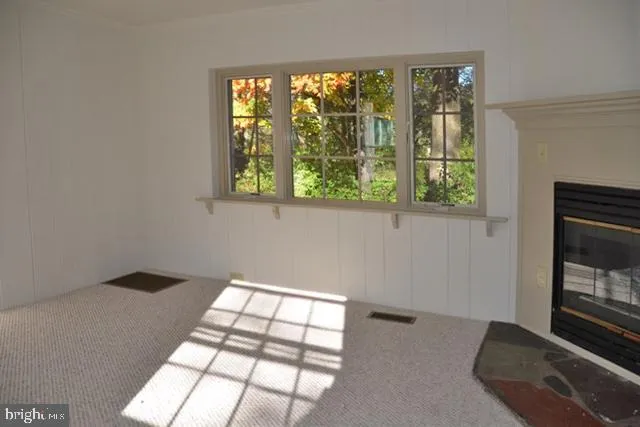 a view of an empty room and window
