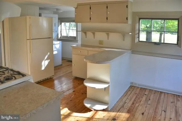 a kitchen with stainless steel appliances granite countertop a stove and a sink