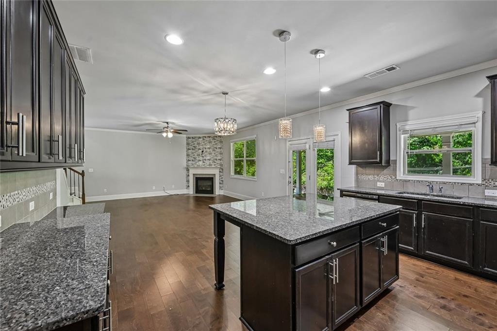 5378 Silverwoods Walk Powder Springs, GA 30127 - Photo 15 of 62 a kitchen with a stove a sink and a refrigerator