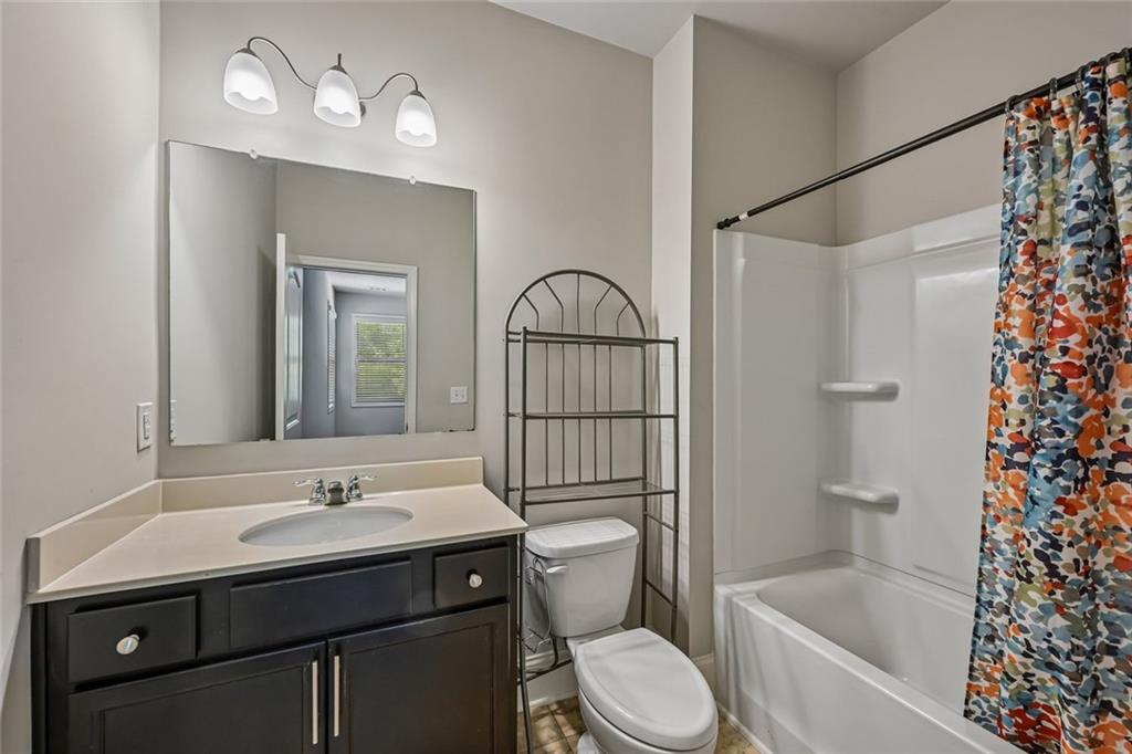 5378 Silverwoods Walk Powder Springs, GA 30127 - Photo 22 of 62 a bathroom with a sink toilet and shower