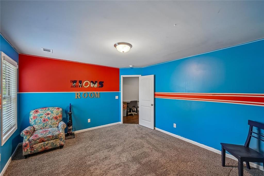 5378 Silverwoods Walk Powder Springs, GA 30127 - Photo 34 of 62 a room with furniture and a projector