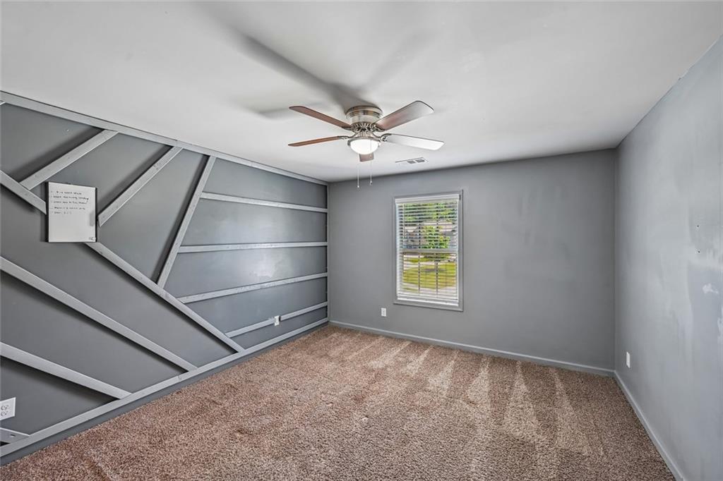 5378 Silverwoods Walk Powder Springs, GA 30127 - Photo 37 of 62 a view of an empty room with a window