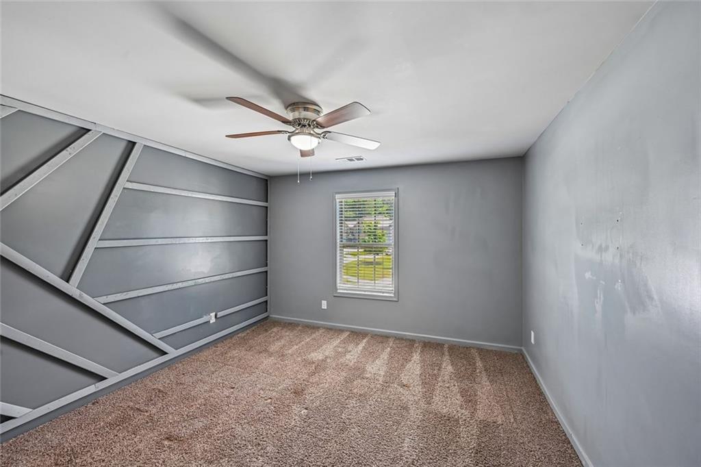 5378 Silverwoods Walk Powder Springs, GA 30127 - Photo 38 of 62 a view of an empty room with a window
