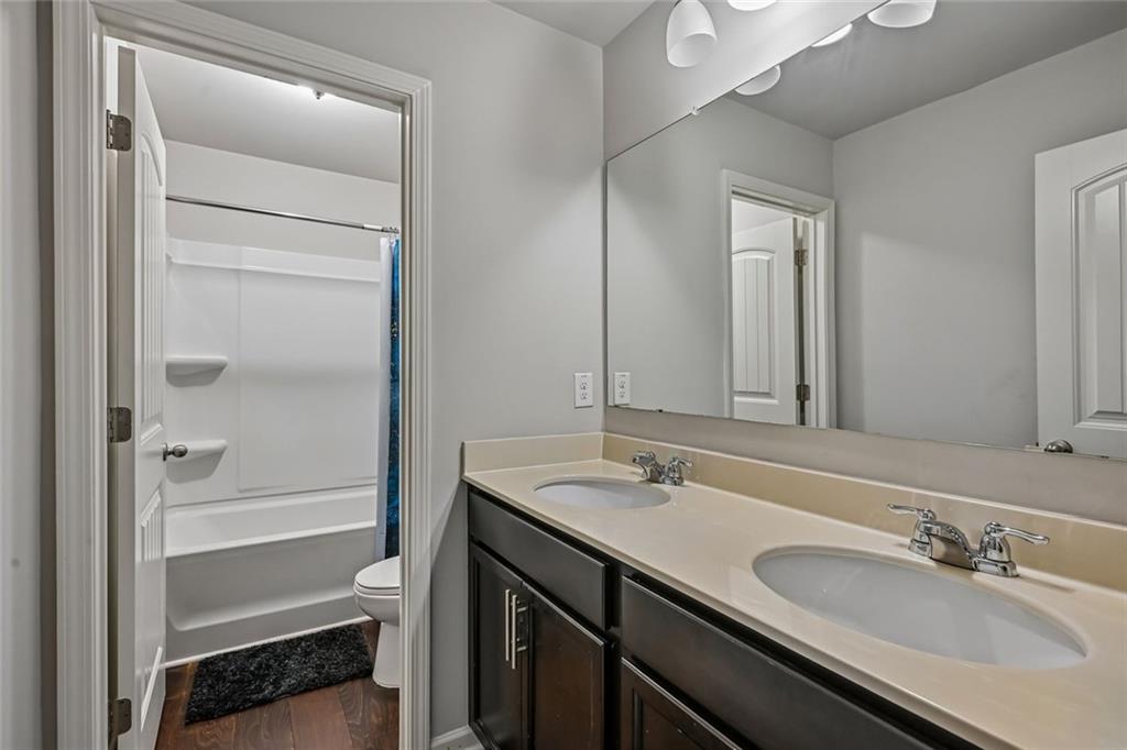 5378 Silverwoods Walk Powder Springs, GA 30127 - Photo 41 of 62 a bathroom with a sink and a mirror