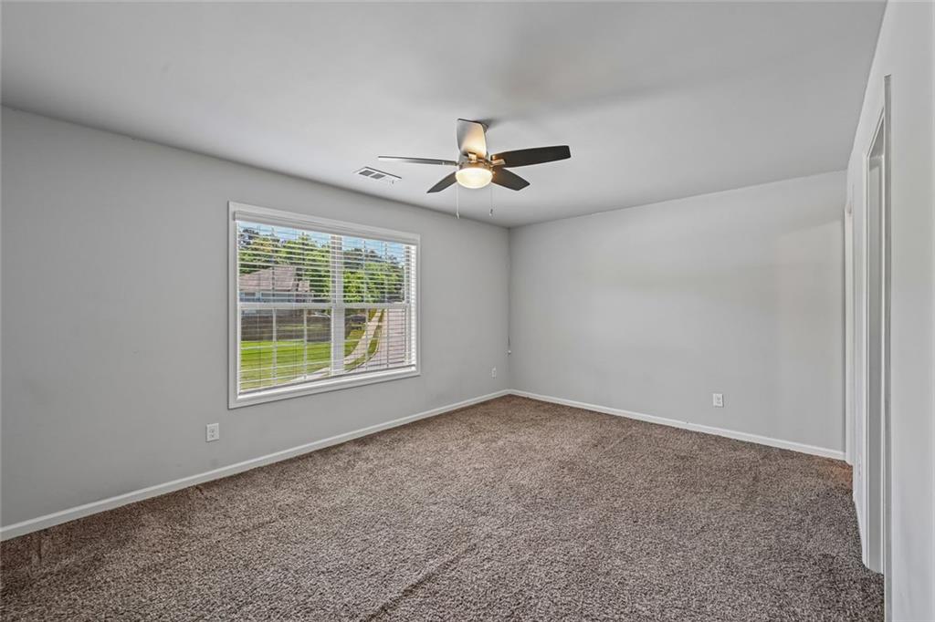 5378 Silverwoods Walk Powder Springs, GA 30127 - Photo 45 of 62 a view of an empty room with a window
