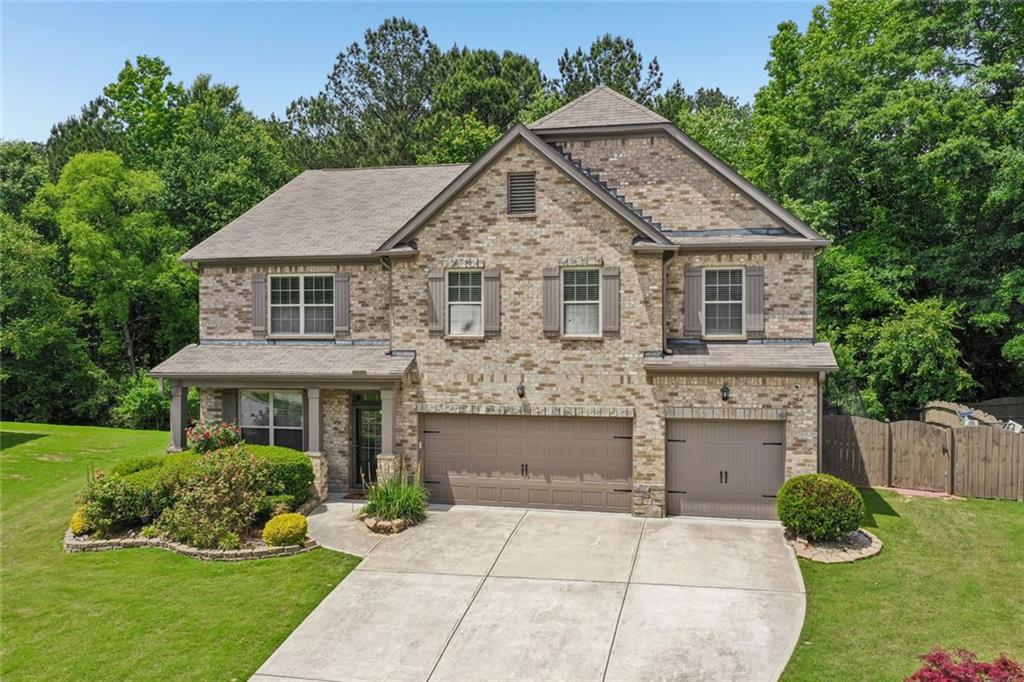 5378 Silverwoods Walk Powder Springs, GA 30127 - Photo 55 of 62 a front view of a house with a yard and garage