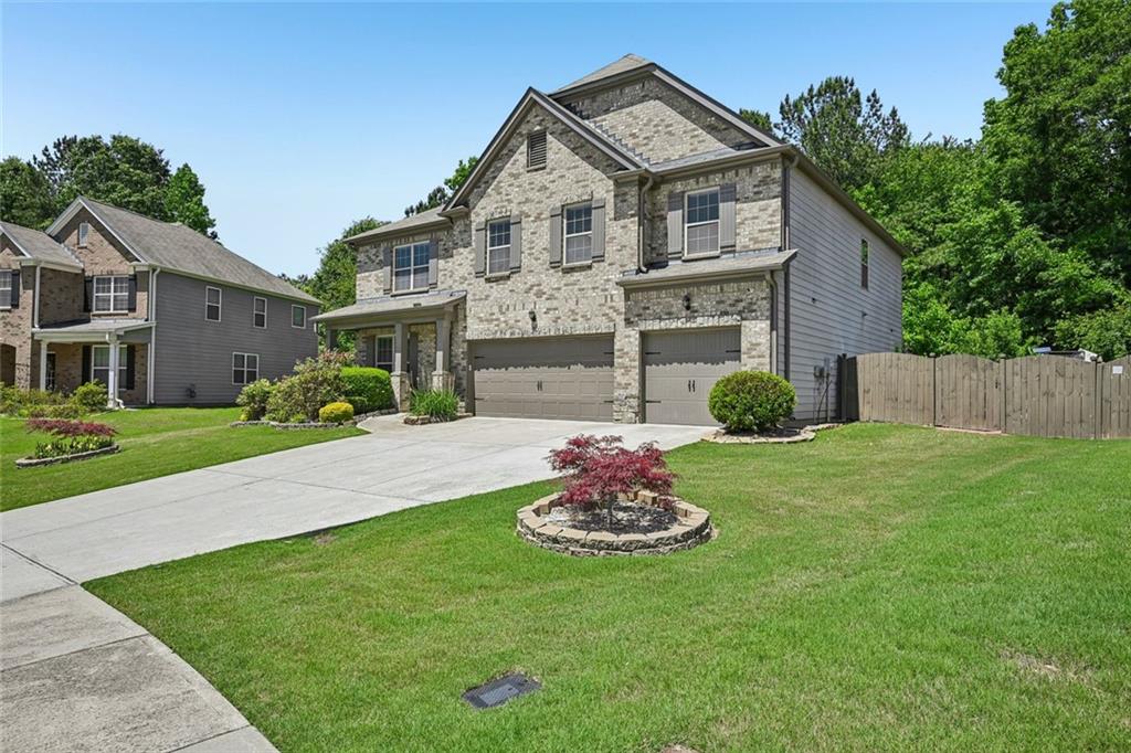 5378 Silverwoods Walk Powder Springs, GA 30127 - Photo 61 of 62 a front view of a house with a garden