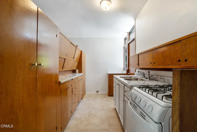 a kitchen with a stove and a sink
