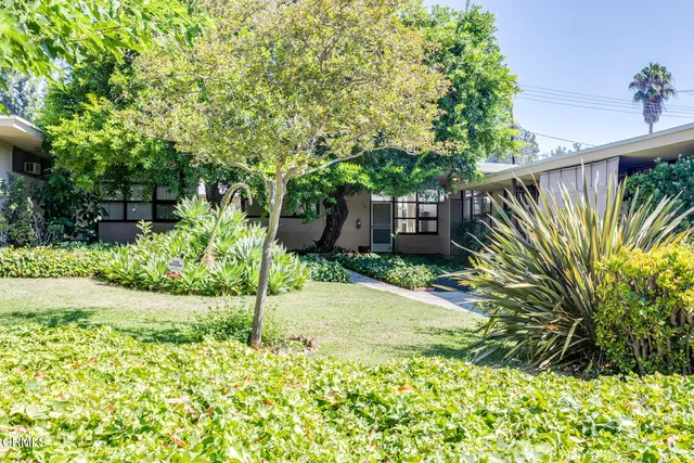 a house view with a garden space