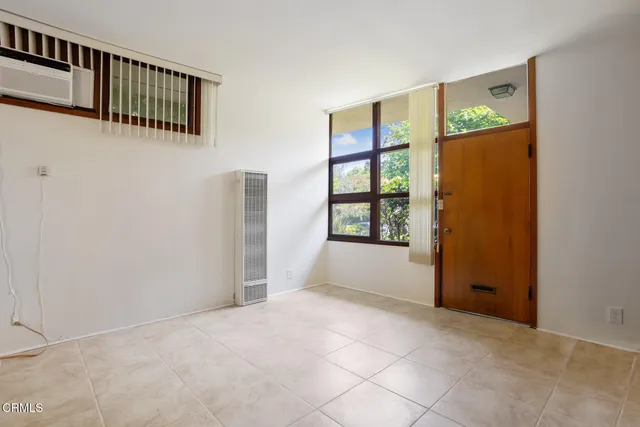 a view of an empty room with windows