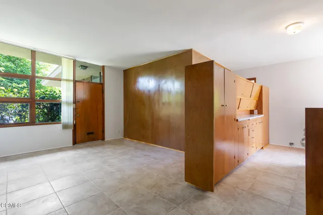 a view of an empty room with a window