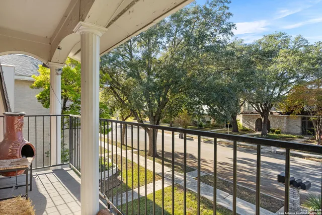 a view of a balcony with wooden floor